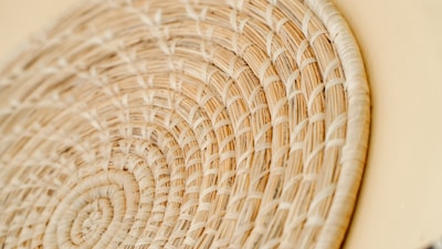 Close-up of a handwoven basket with natural fibers and earthy tones.