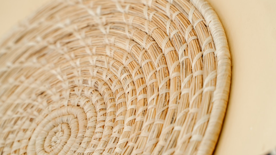 Close-up of a handwoven bamboo handbag showcasing intricate weaving patterns and natural bamboo texture.