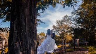 An elegant wedding scene featuring a couple surrounded by nature.