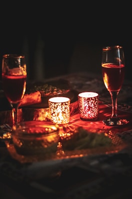 A cozy atmosphere with candles lit in a romantic setting.