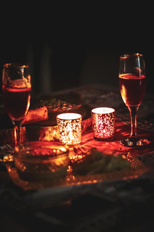 A warmly lit evening gala with guests mingling under soft bordeaux lighting, capturing intimate moments.