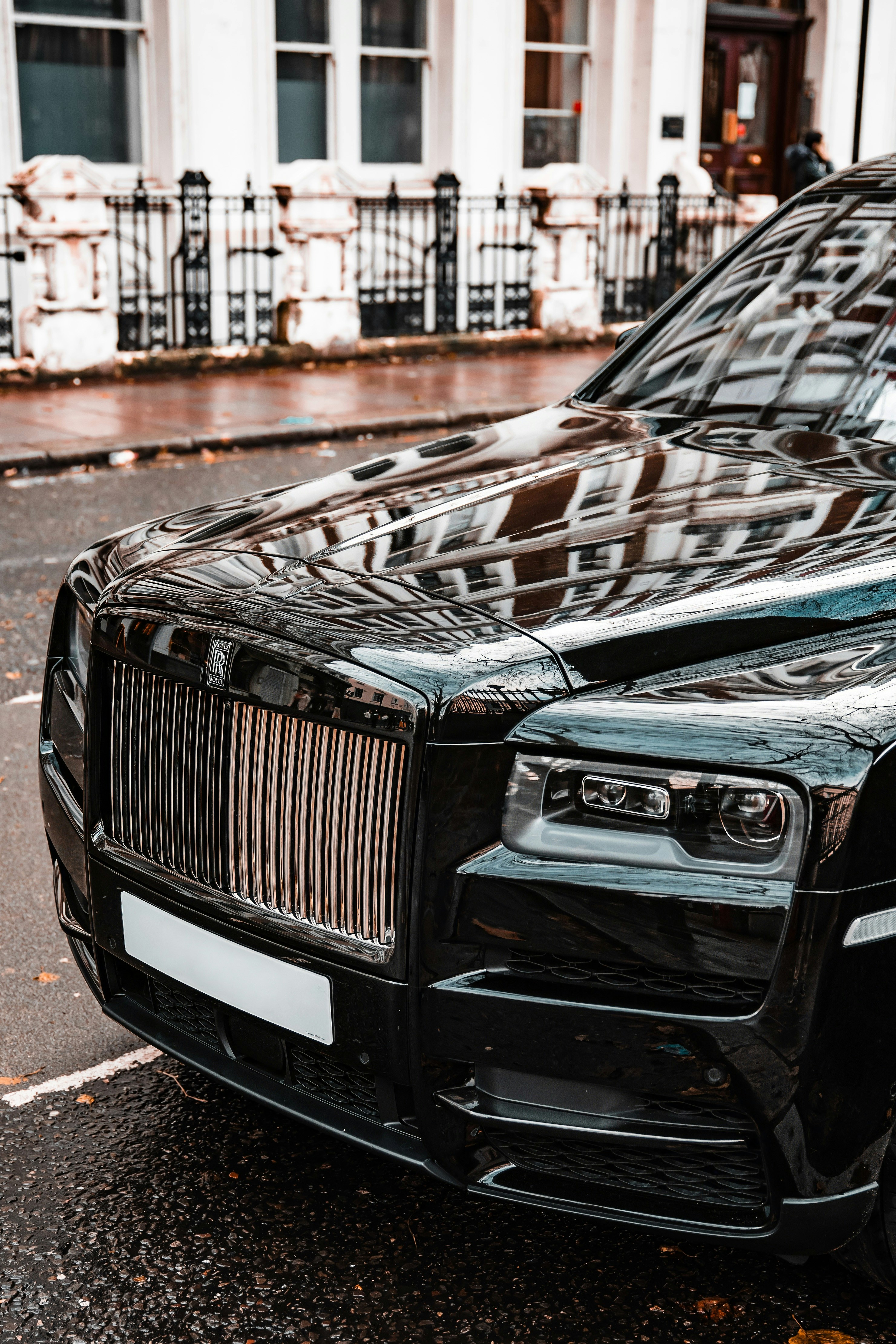 a black car parked on the side of the road