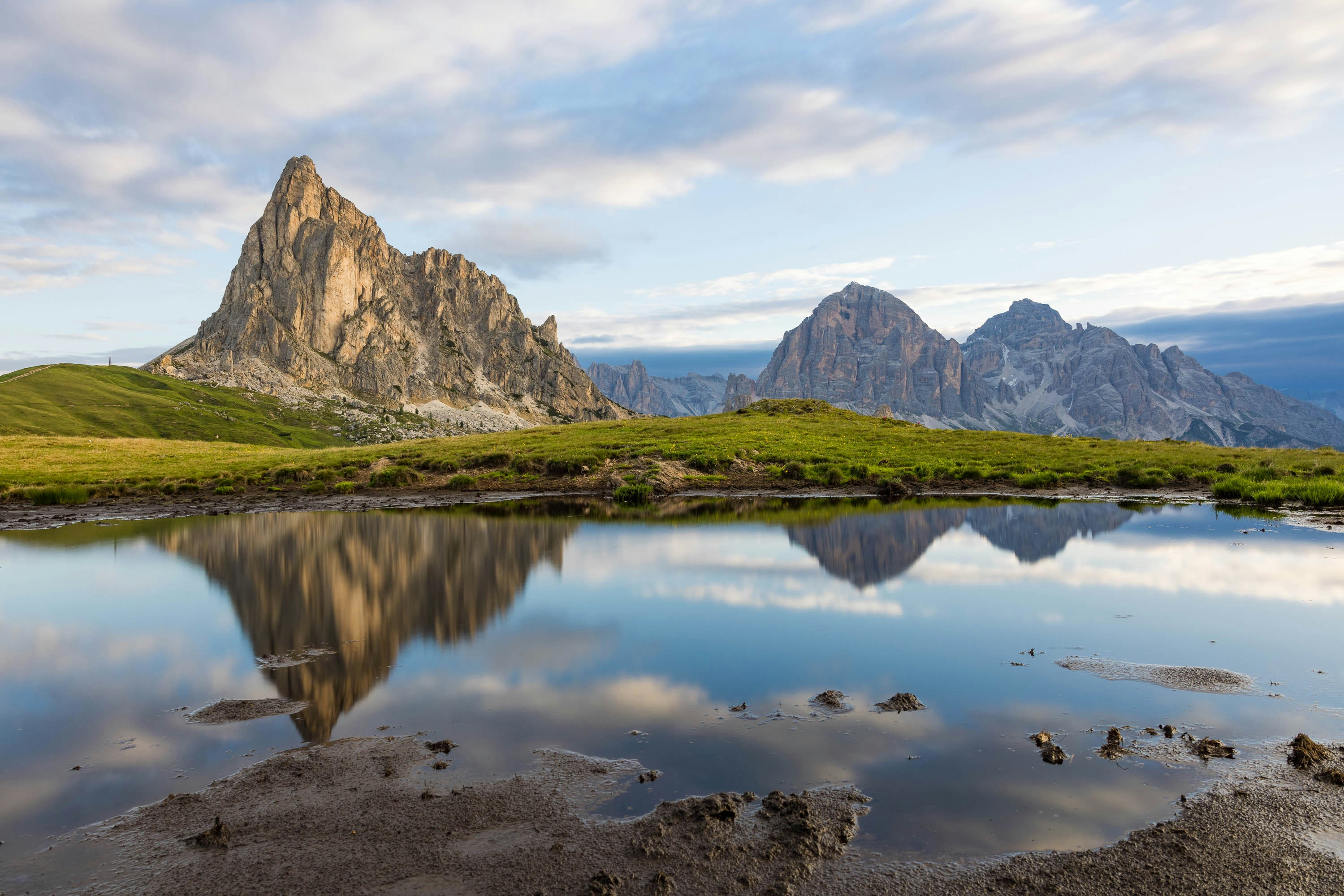 a mountain range with a body of water in the foreground