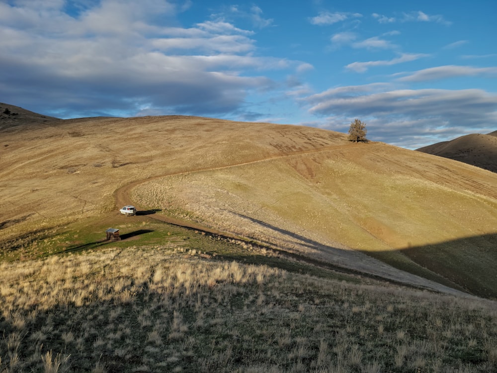 a hill with a house on top of it