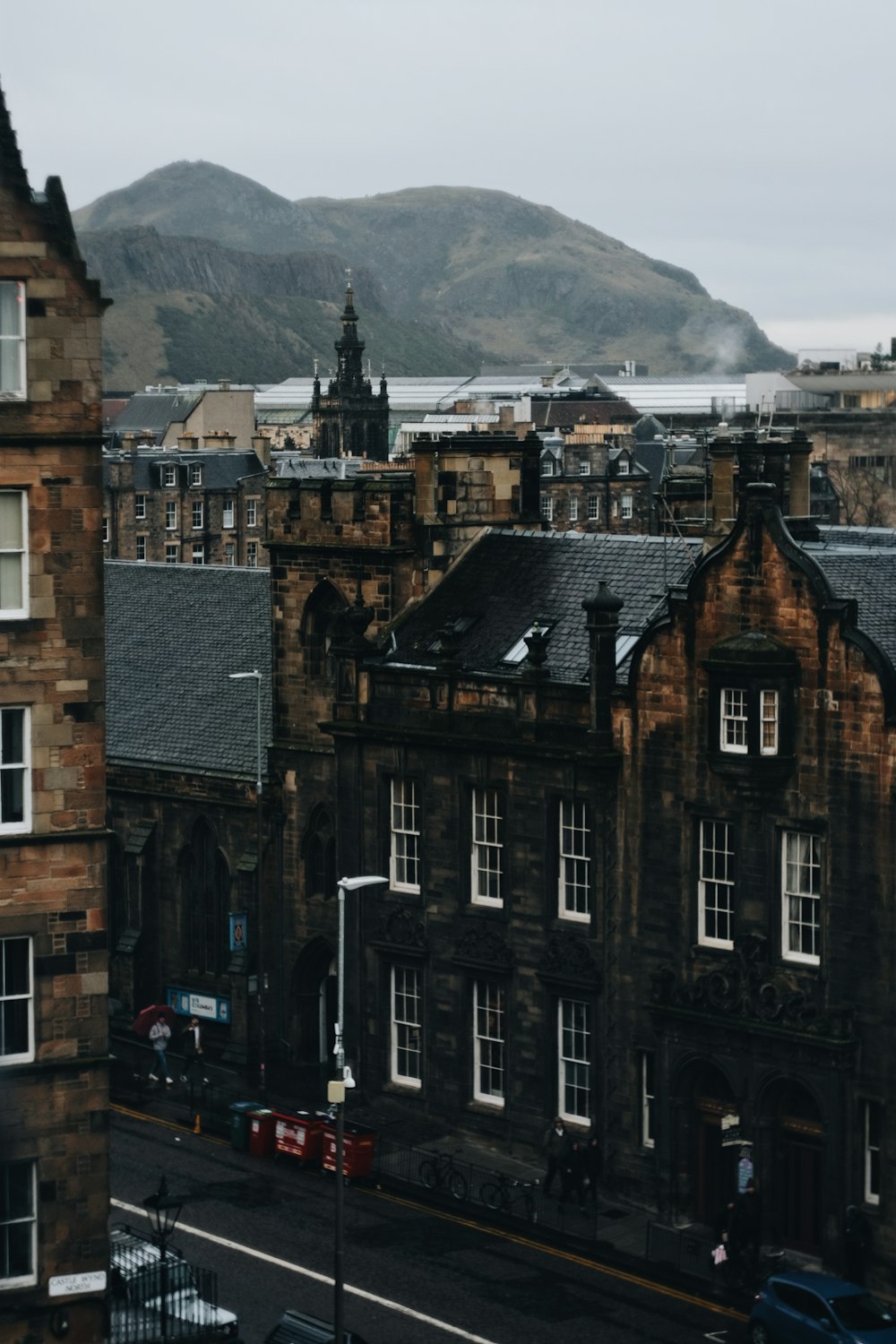 a view of a city with a mountain in the background