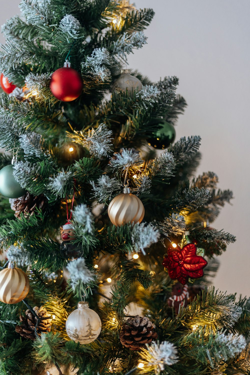 a small christmas tree with ornaments on it