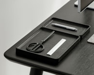 A sleek desk organizer made of colorful ABS plastic.