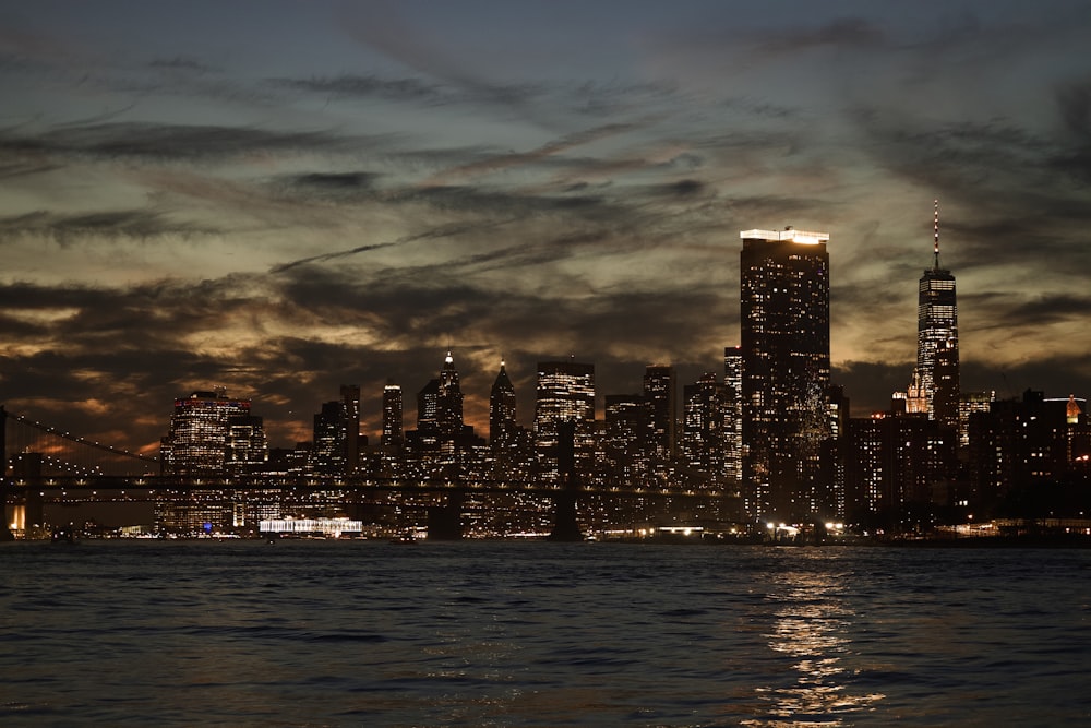 a view of a city at night from the water