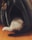 A fluffy cat's tail and back end are sticking out from inside a dark, plush pet bed shaped like a cave. The pet bed is situated on a wooden floor and appears cozy and inviting. There is also a small stuffed bird toy attached to the upper part of the bed.