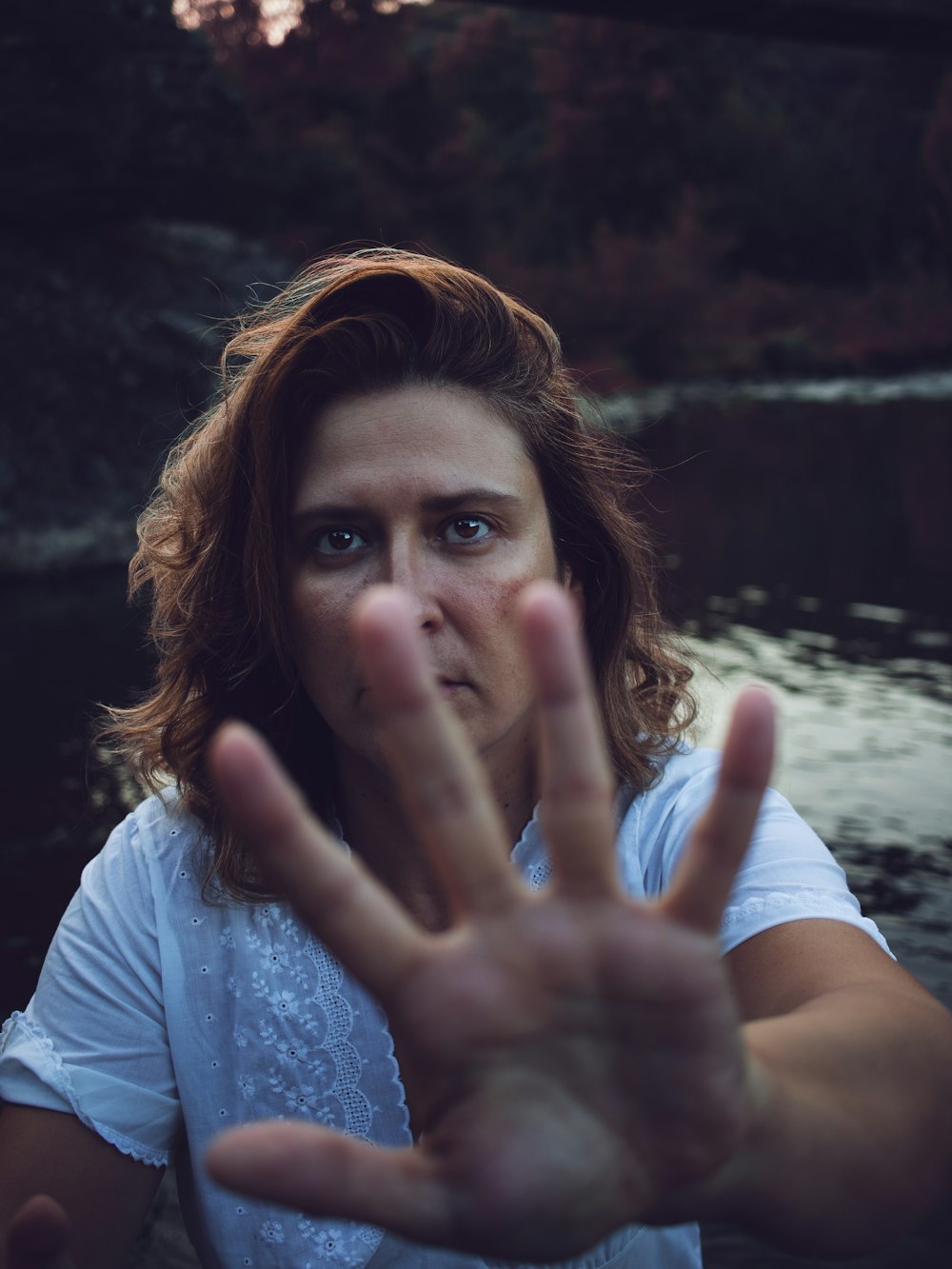 a woman making the vulcan sign with her hands