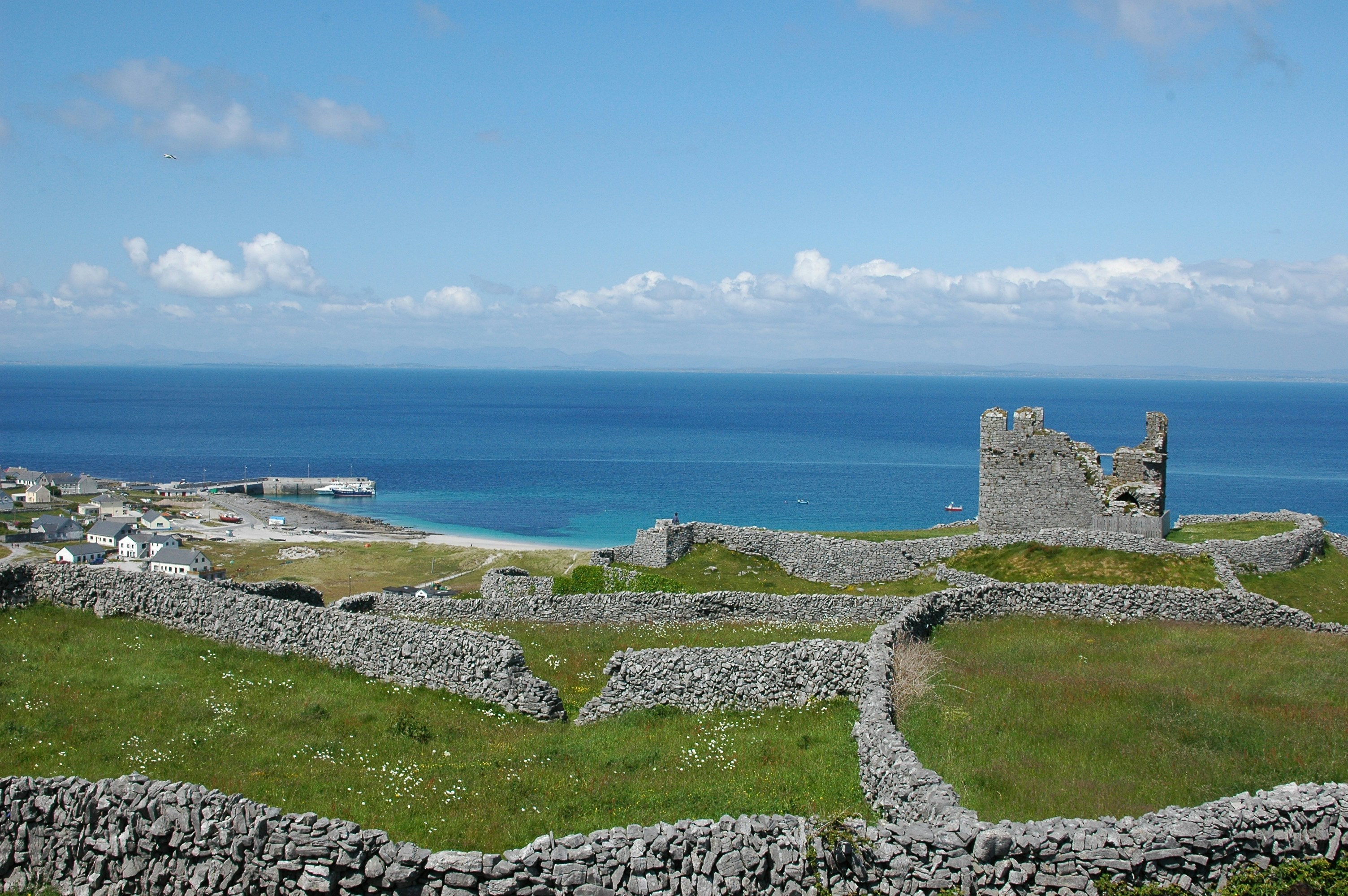 a view of the ocean from the top of a hill