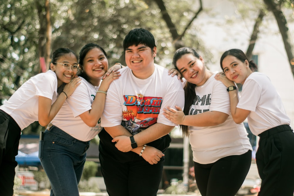 a group of young people standing next to each other