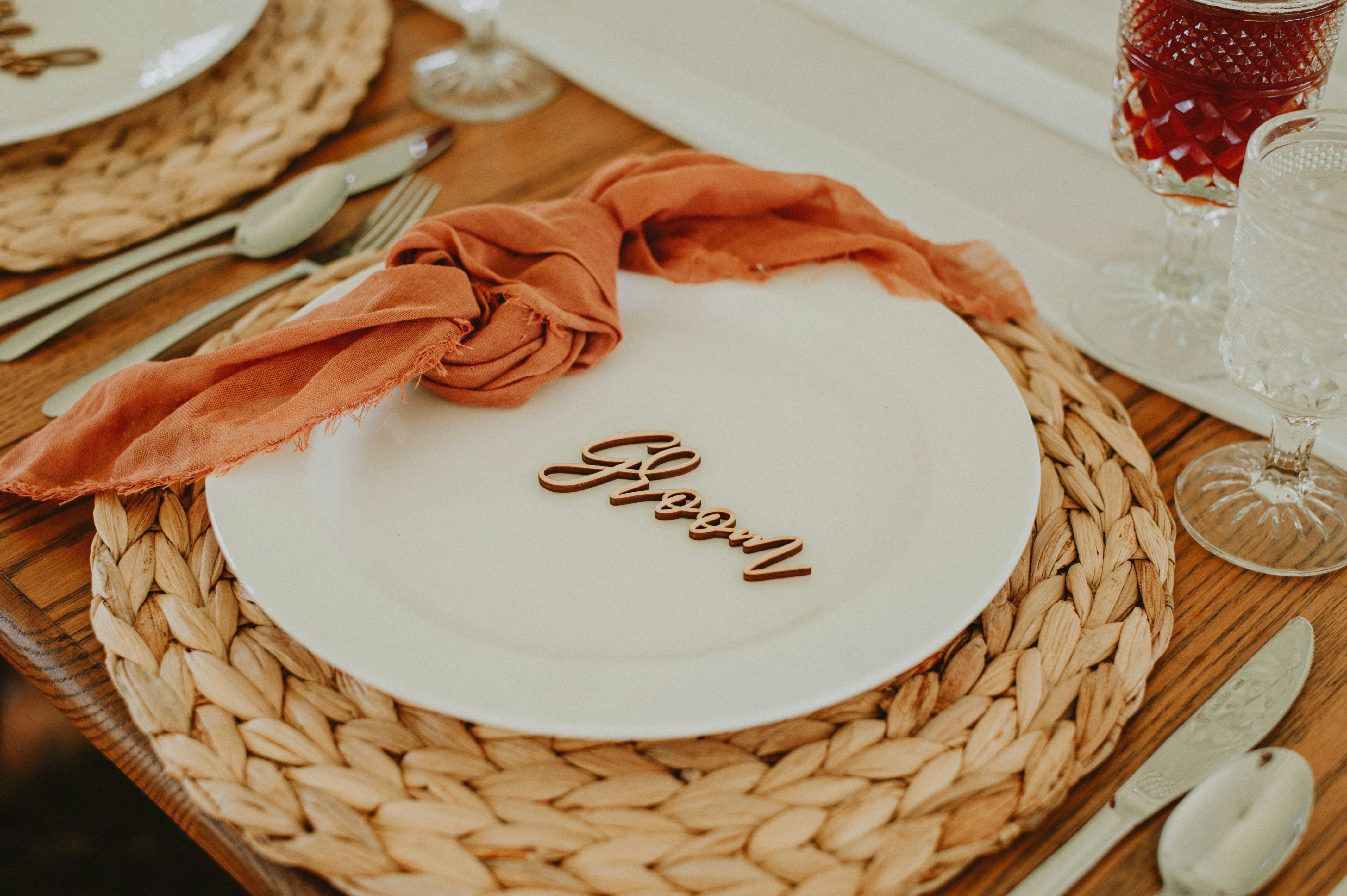 a plate with a napkin on it sitting on a table