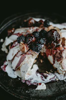 A decadent dessert with rich chocolate drizzle and fresh berries, inviting and warm.