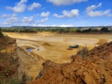 Close-up of workers operating drilling and blasting equipment in a quarry