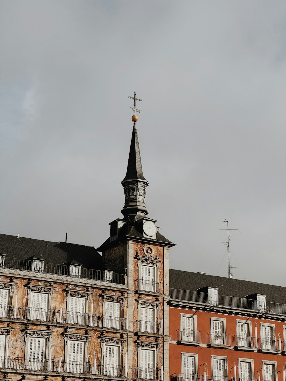 a tall building with a clock on the top of it