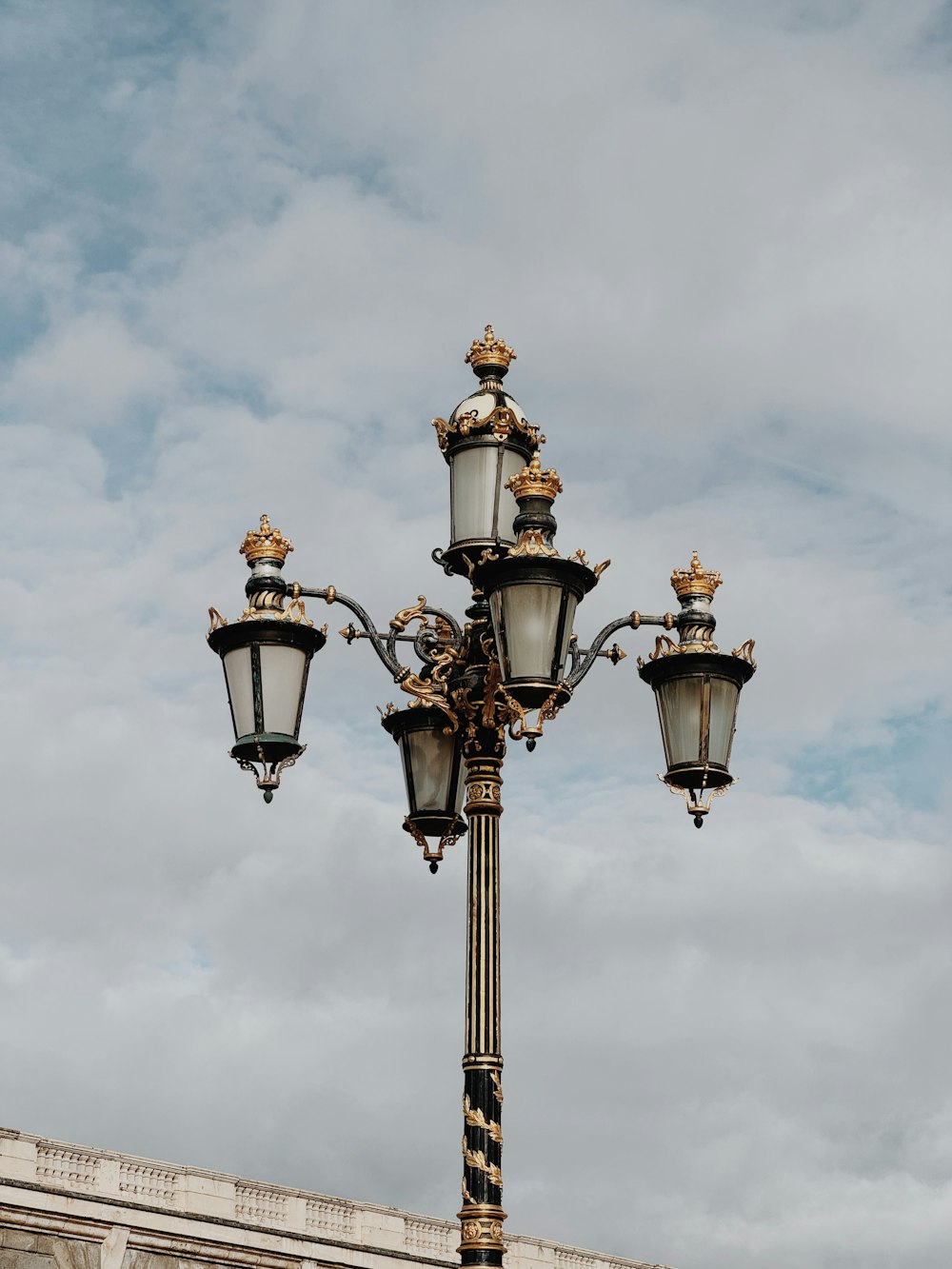 a lamp post with three lights on top of it