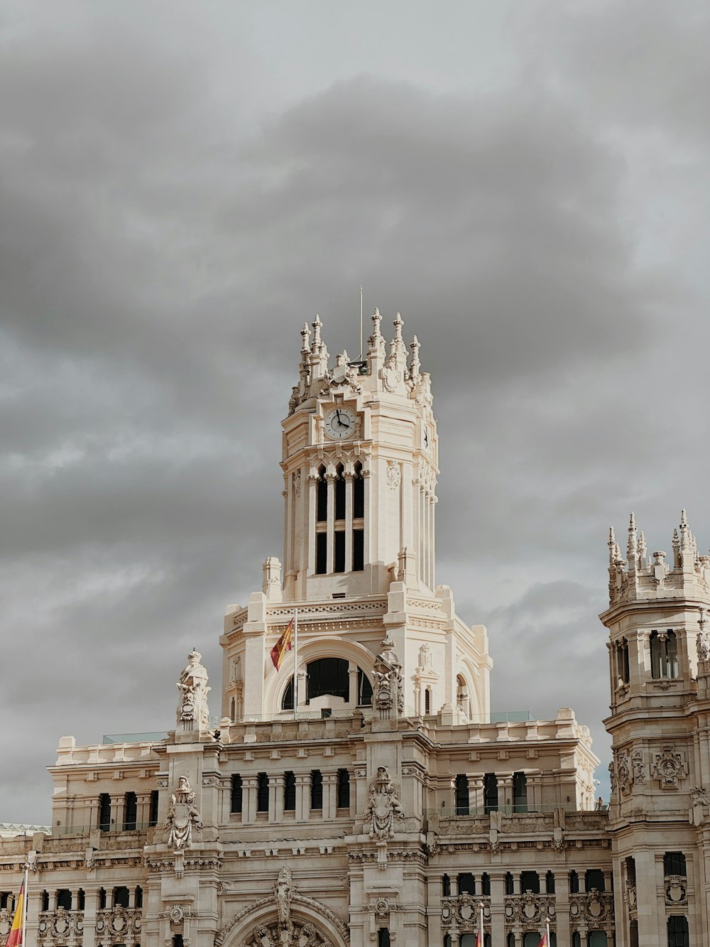 a large white building with a clock tower