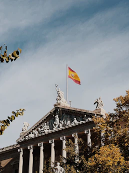 a flag on top of a building with columns