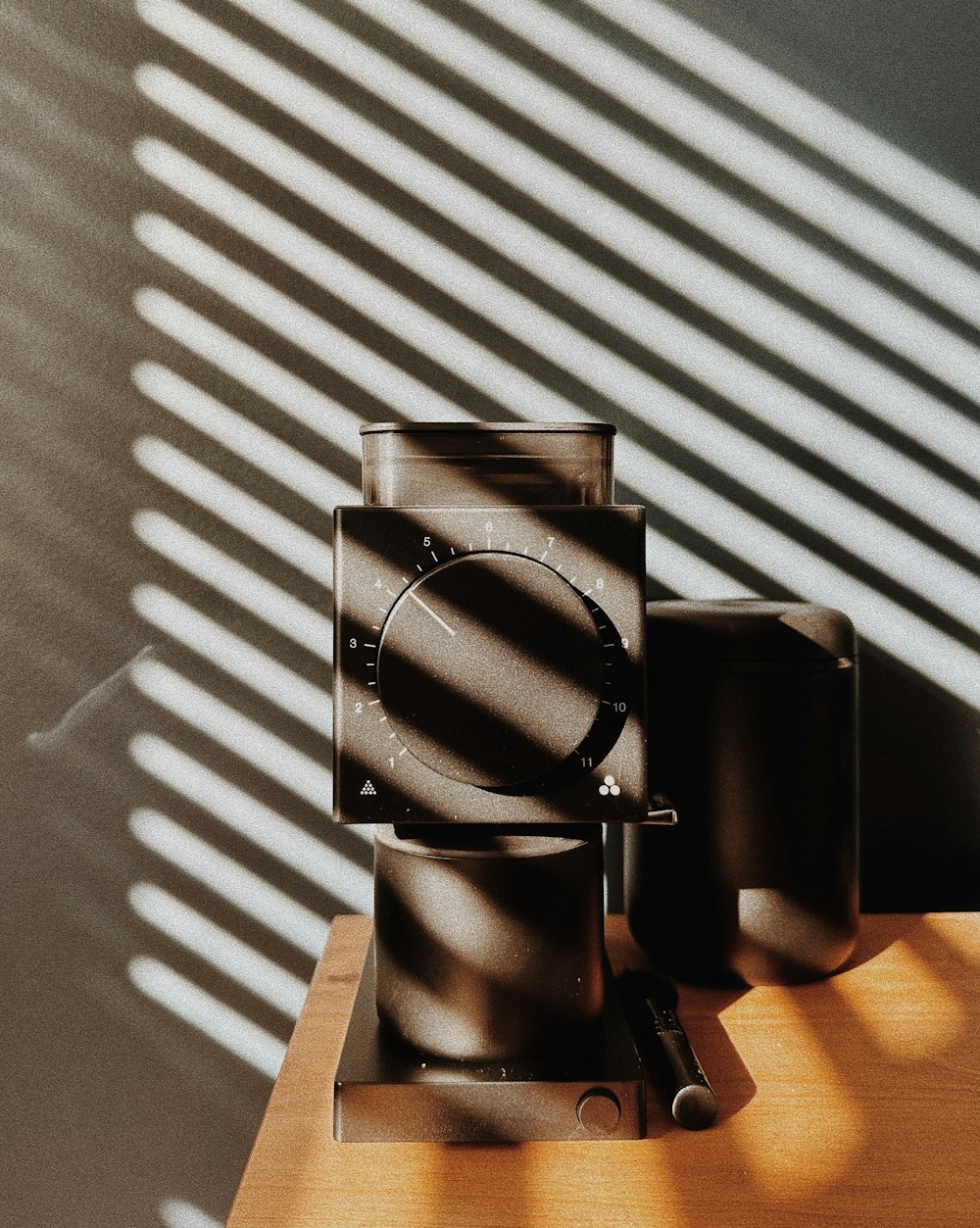 a clock sitting on top of a wooden table