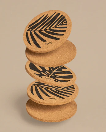 Stack of smooth wooden coasters crafted from factory scraps.