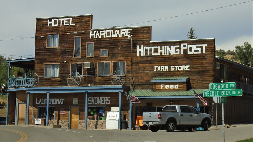 a truck is parked in front of a building