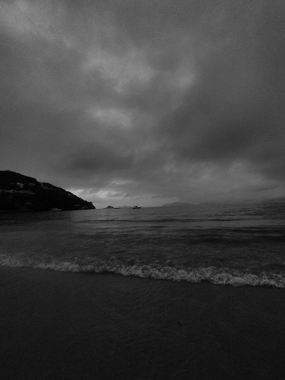 a black and white photo of the ocean