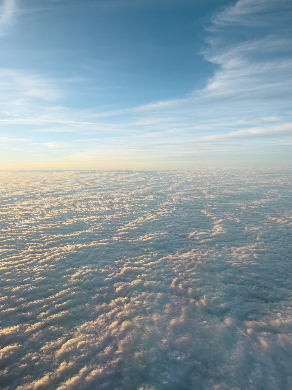 a view of the sky and clouds from an airplane