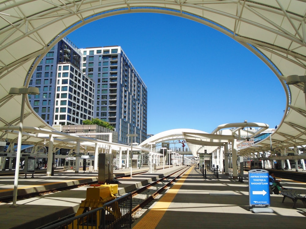 a train station with a train on the tracks