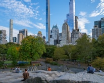 A scenic view of Legnica's city park with people jogging and enjoying outdoor activities.