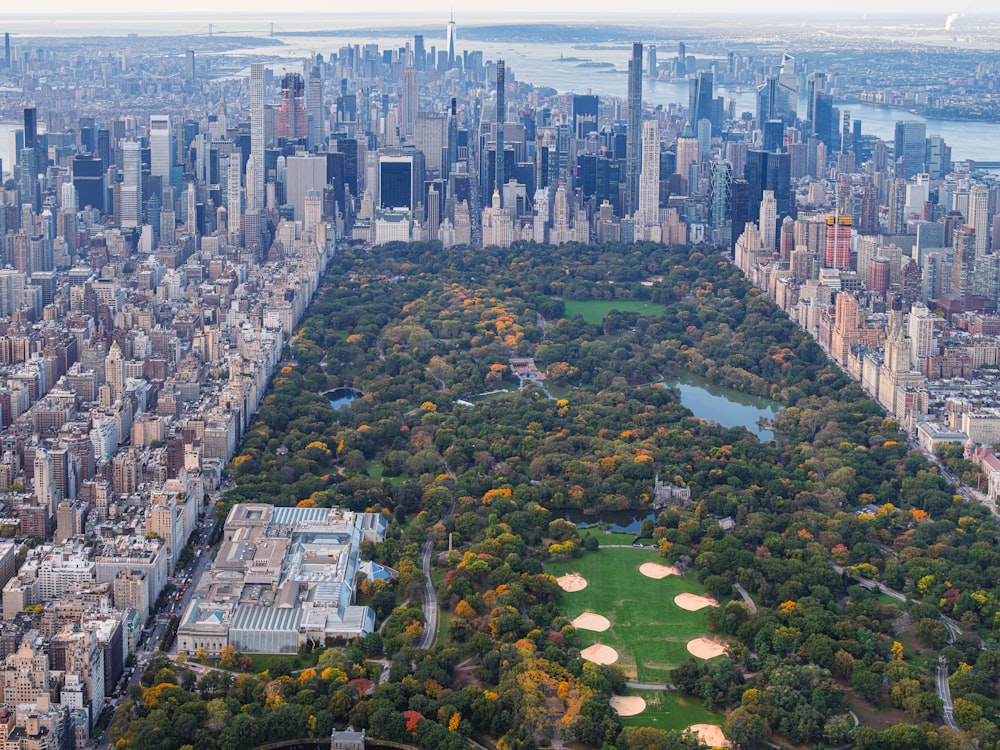 an aerial view of a large city with lots of trees