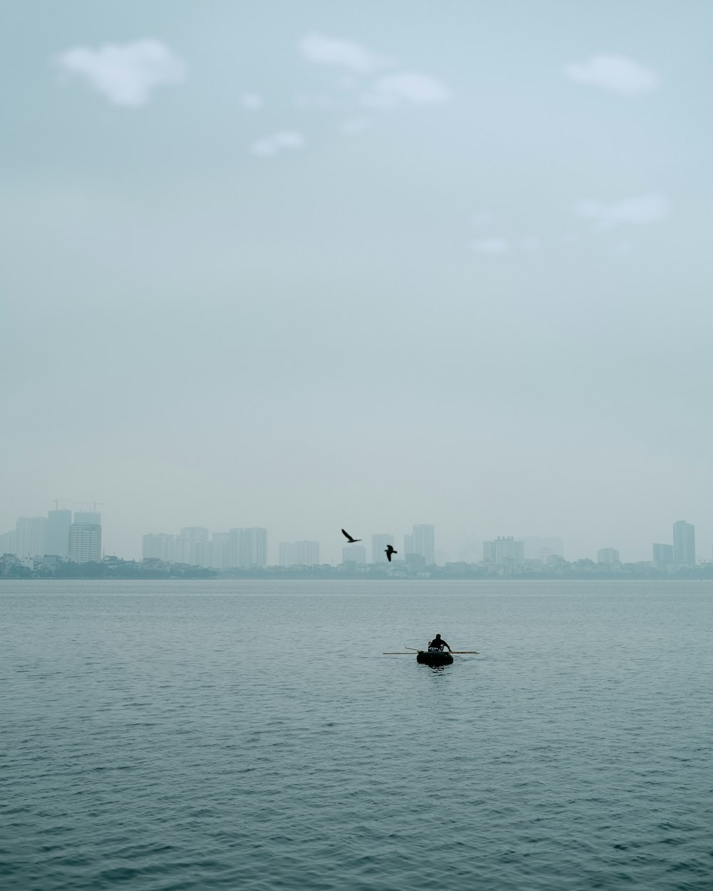 a person in a boat on a large body of water