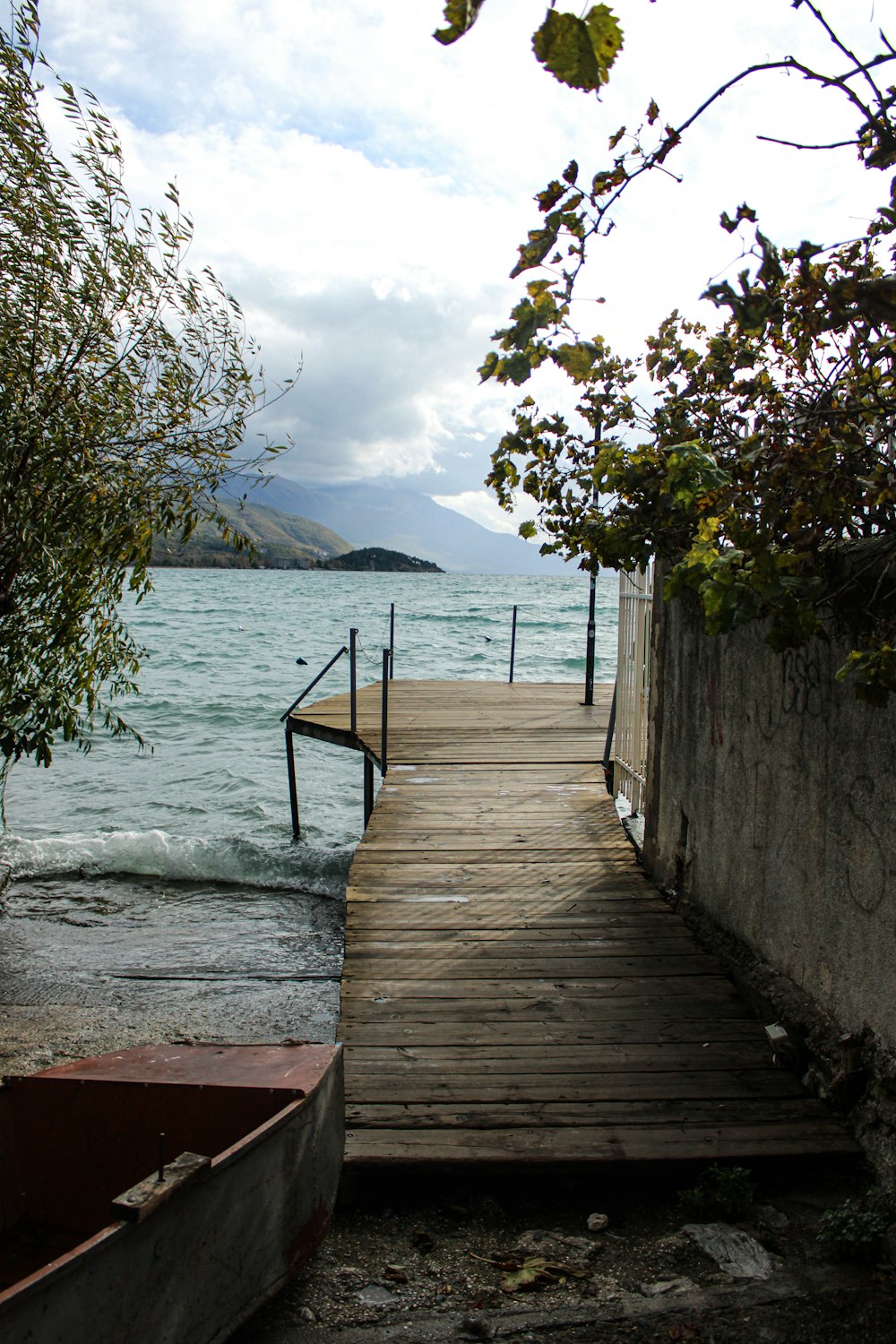 a wooden dock leading to a body of water