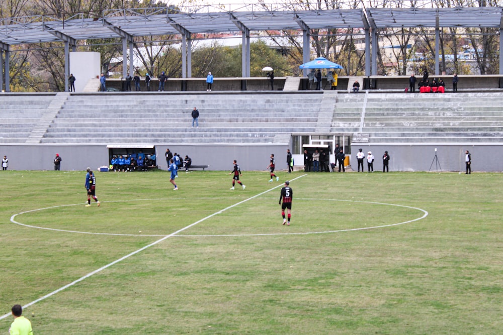 a group of people on a field playing soccer