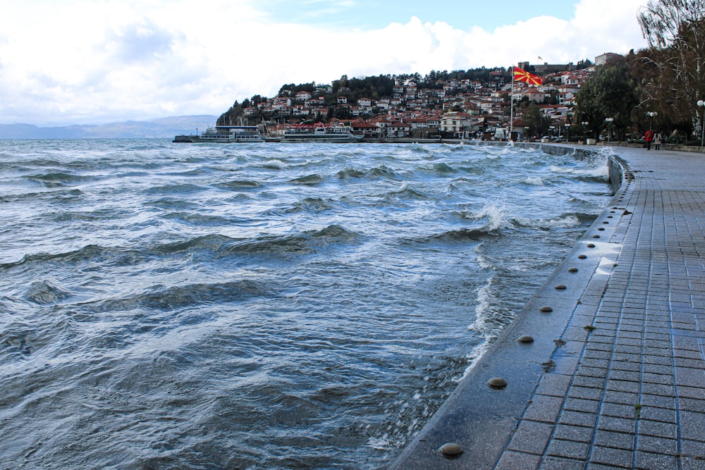 a body of water with a city in the background