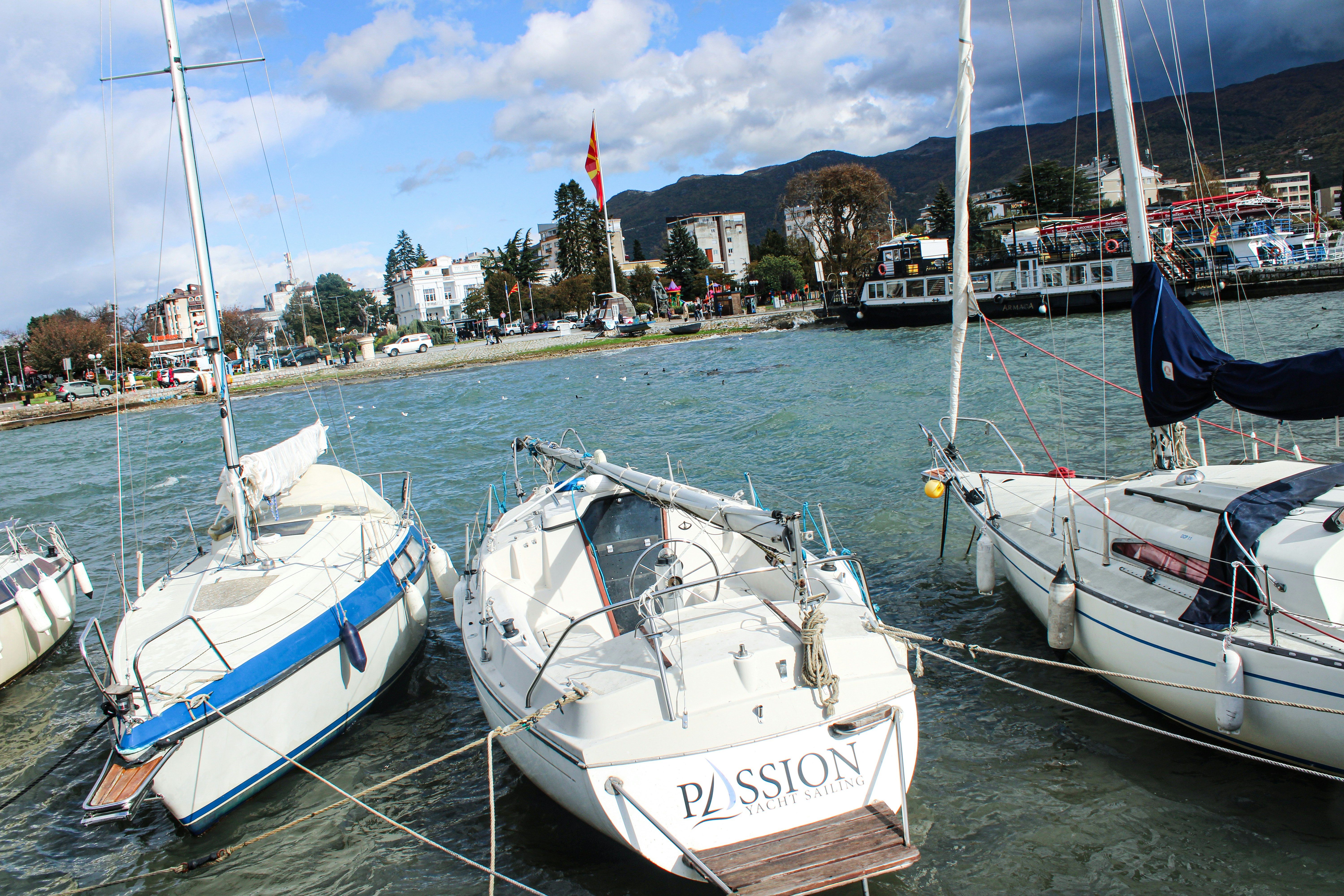 a group of sailboats docked in the water