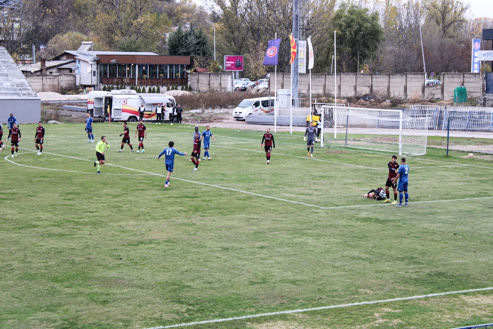 a group of people on a field playing soccer