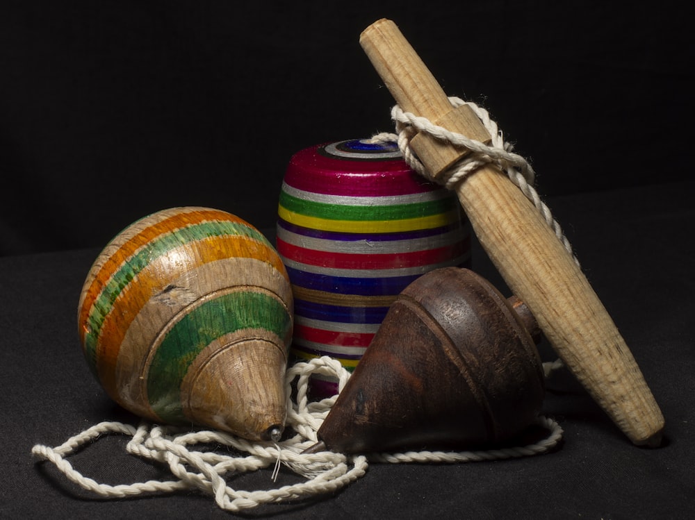 a group of wooden toys sitting on top of a black surface