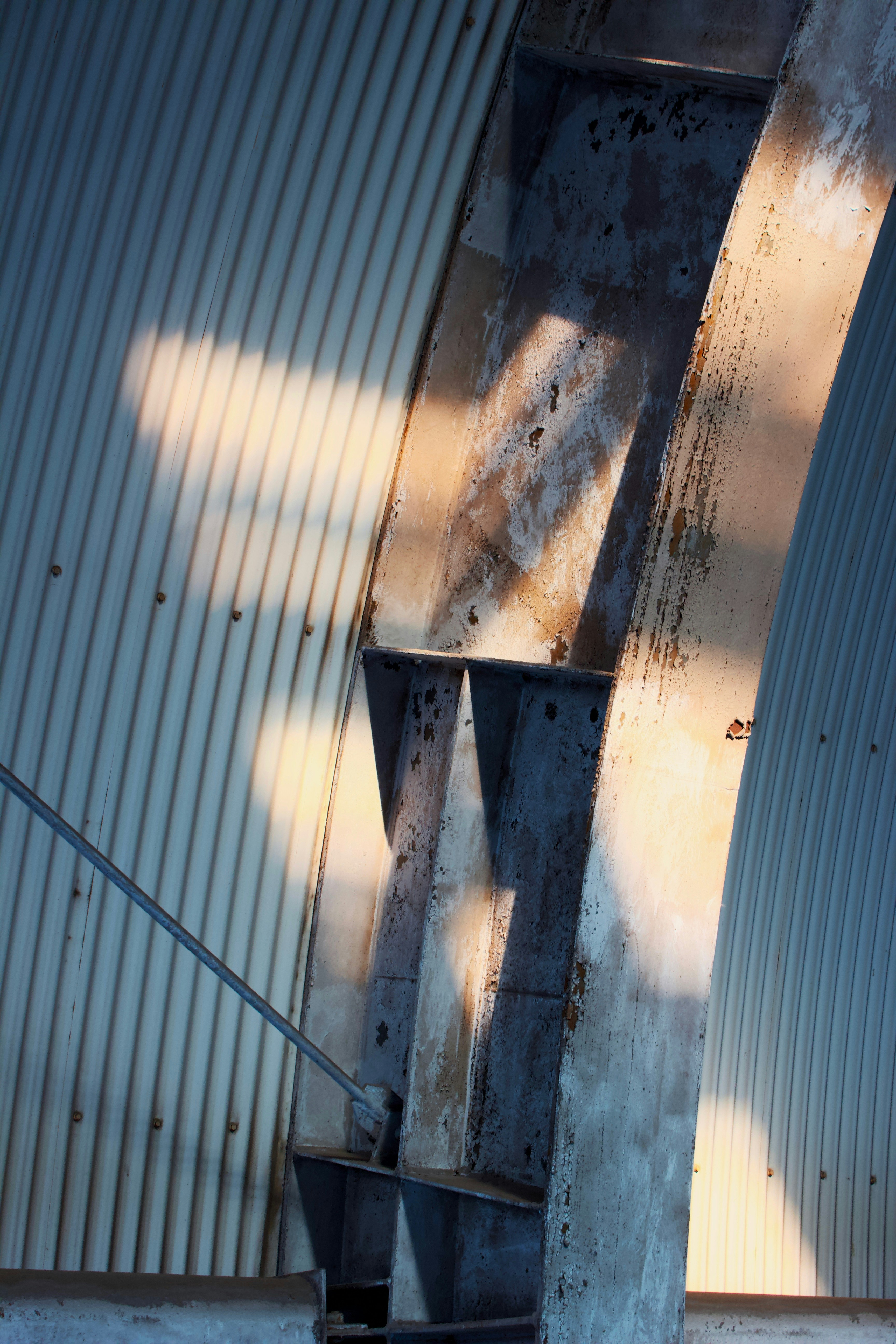 a man riding a skateboard down a metal ramp