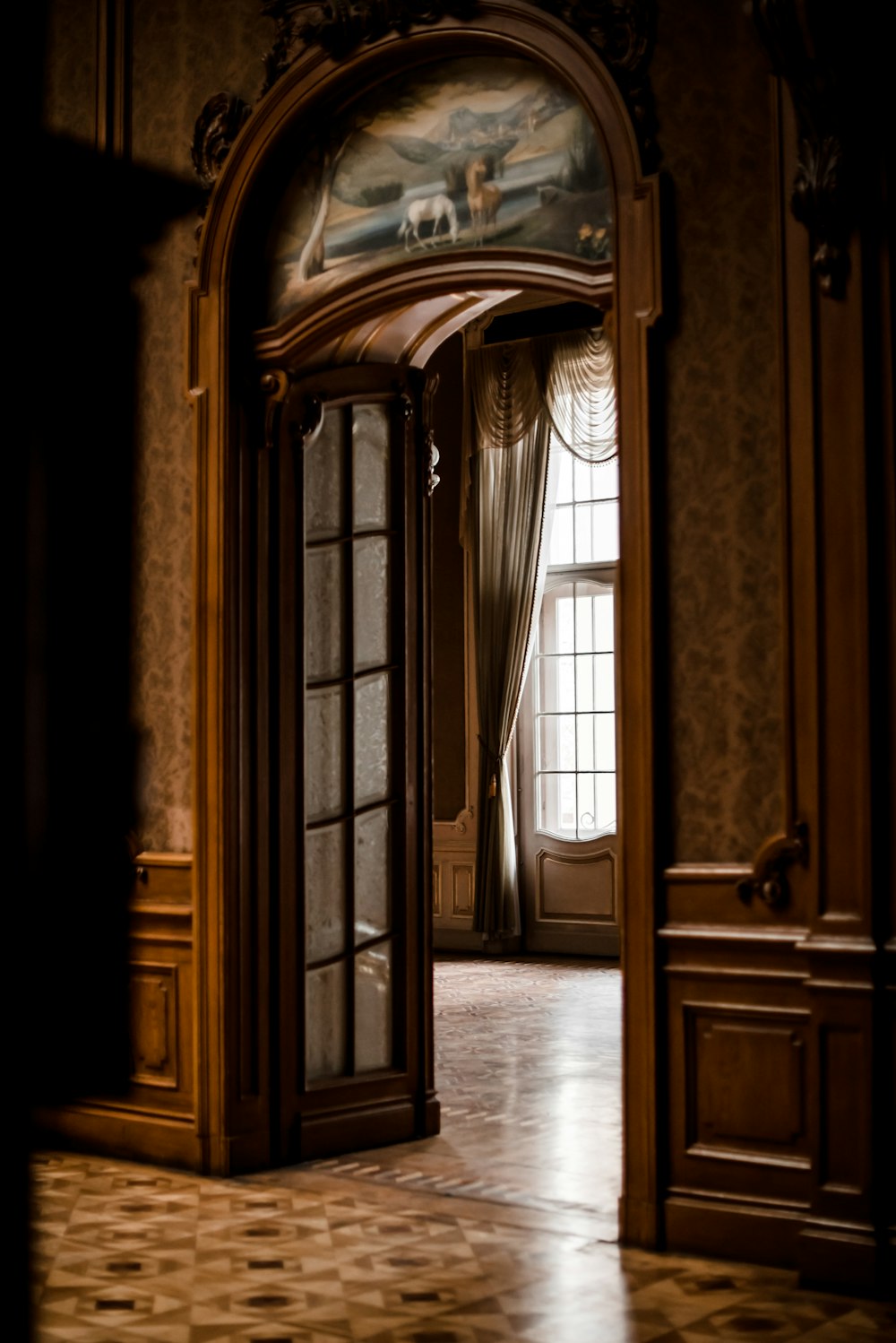 a doorway leading into a room with a painting on the wall