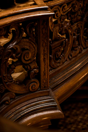 Intricate wood burning design featuring a swirling pattern of leaves and vines.
