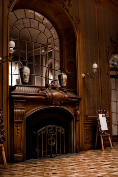 A beautifully hung picture frame above a fireplace.