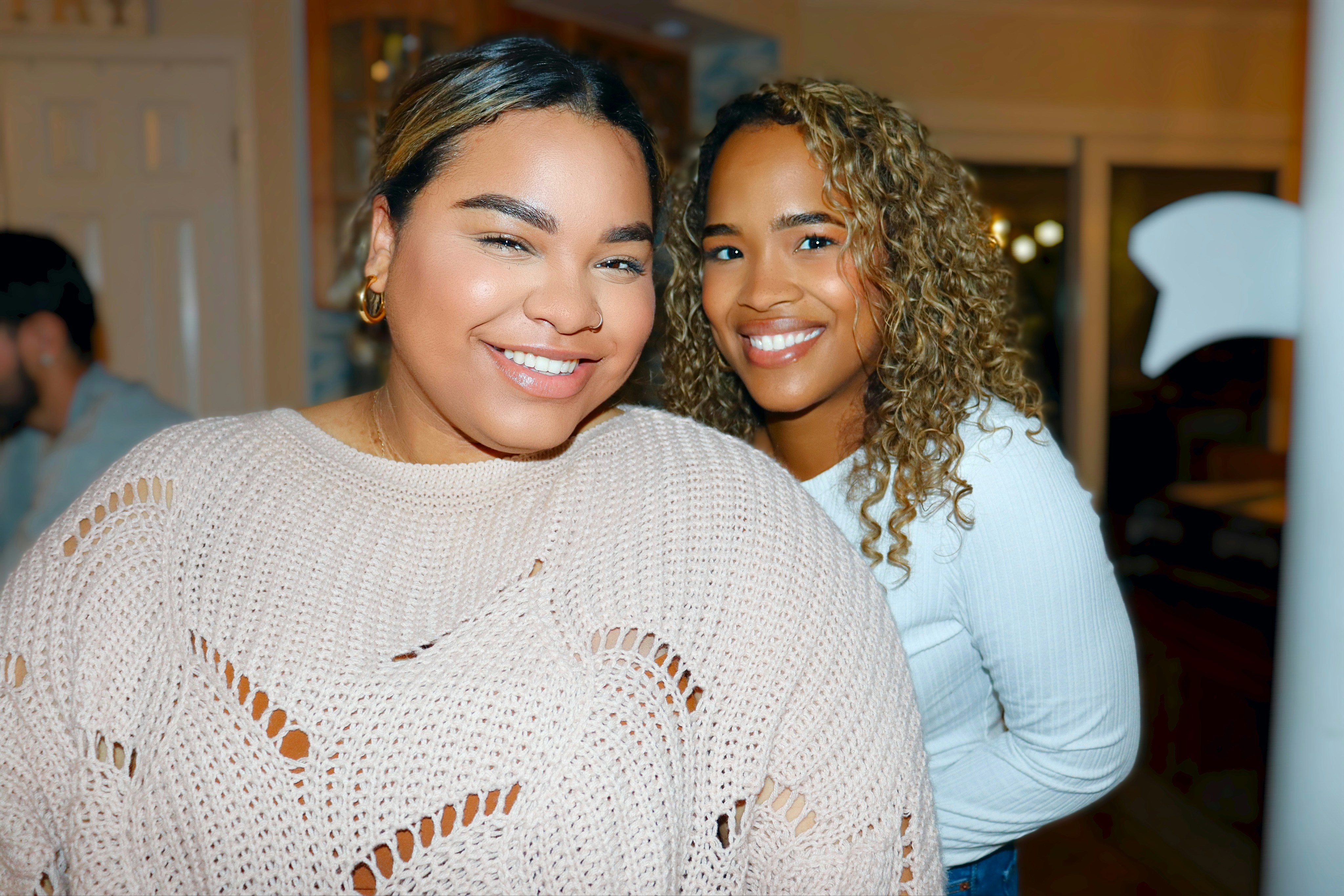 a couple of women standing next to each other