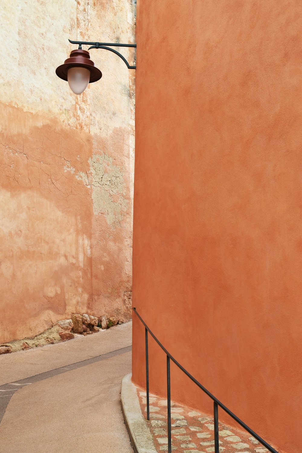 a street light hanging from the side of a building