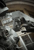 Close-up of a bronze sculpture element integrated within a dark luxury interior environment.