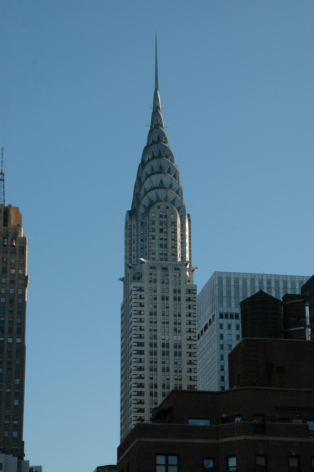 a very tall building towering over a city