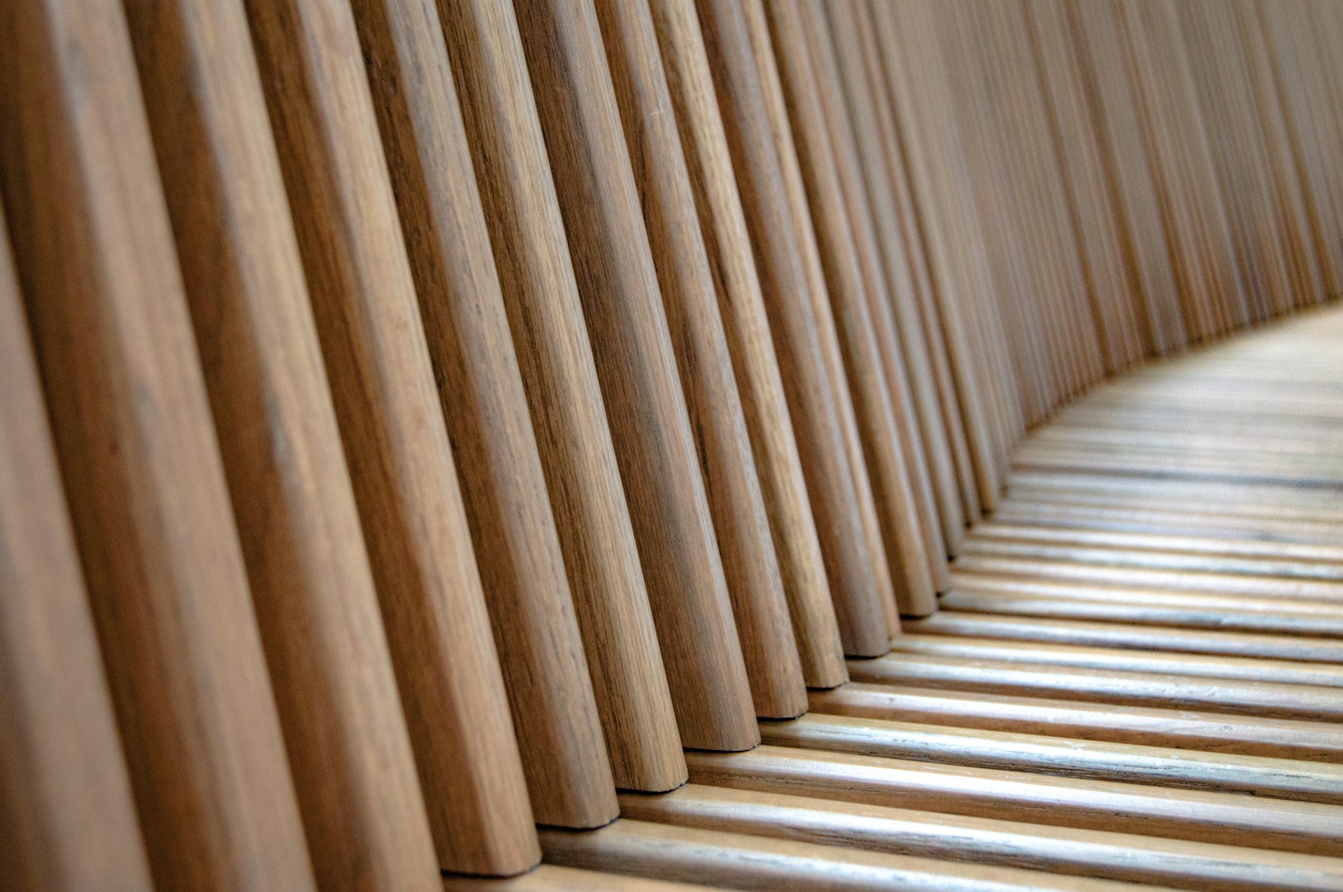a row of wooden slats lined up against a wall