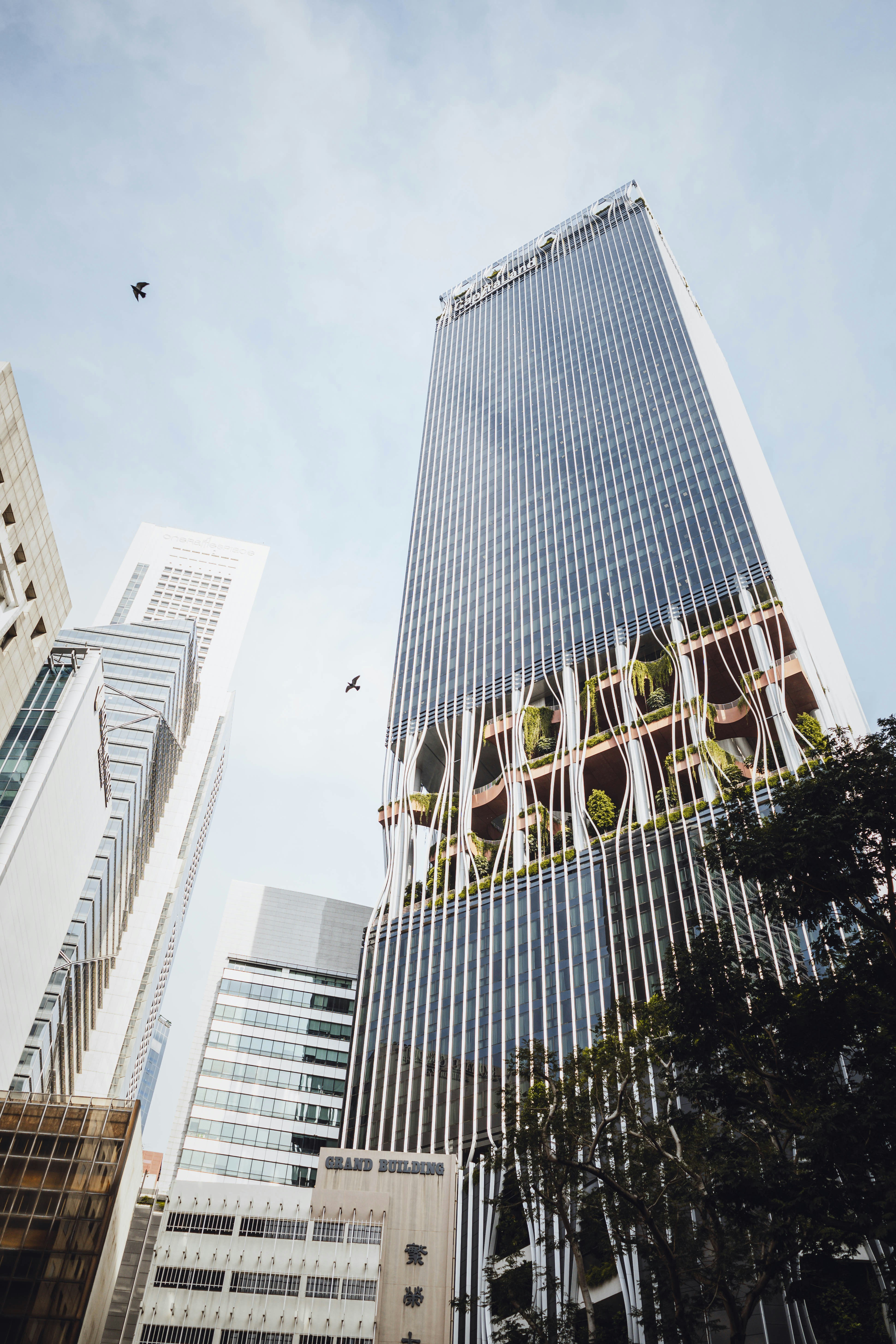 a very tall building with a sign on it's side