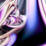 A vibrant abstract shape bursting with purple and black gradients symbolizing creative energy.