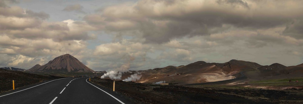 a long road with smoke coming out of it